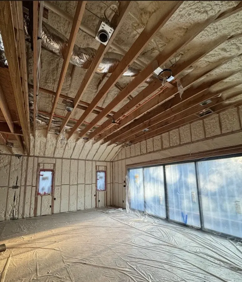 Interior walls and ceiling insulated with spray foam during new construction in Acushnet